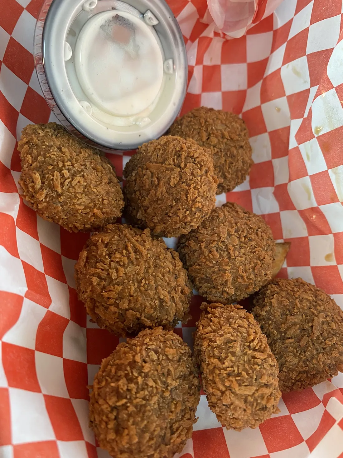 Pickle Bombs with ranch in a checkered-paper basket